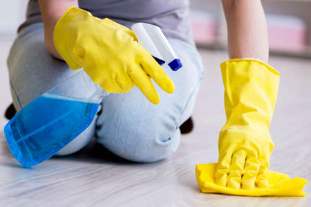 Woman doing cleaning at home
