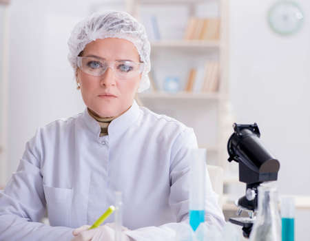Woman chemist working in hospital clinic labの写真素材