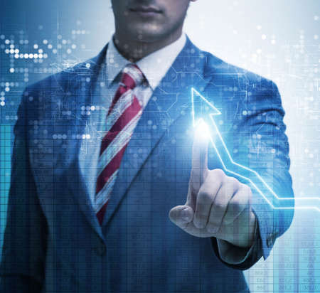 BUsinessman pressing virtual button on diagram chartの写真素材