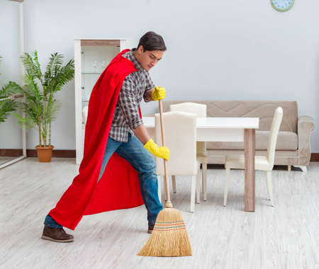Super hero cleaner working at home