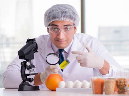 Nutrition expert testing food products in labの写真素材