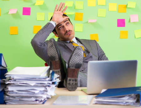 Businessman having trouble with his priorities