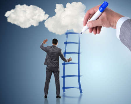 Businessman climbing career ladder in business conceptの写真素材