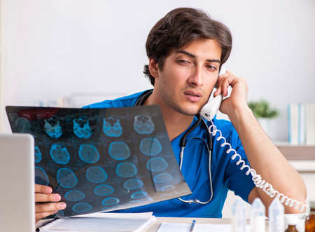 Doctor in telemedicine concept with phone