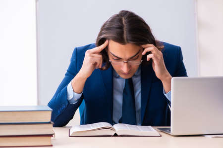 Young businessman student studying at workplaceの写真素材