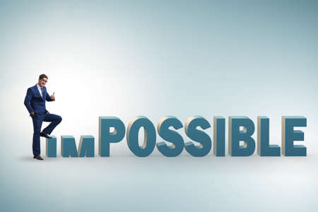 Businessman in impossible business conceptの写真素材
