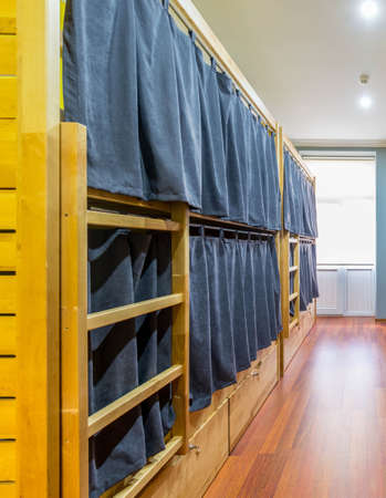 Hostel dormitory beds arranged in room