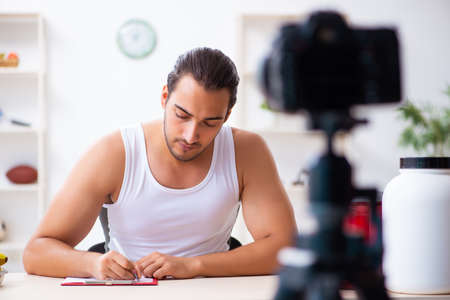 Young male blogger in dieting conceptの写真素材