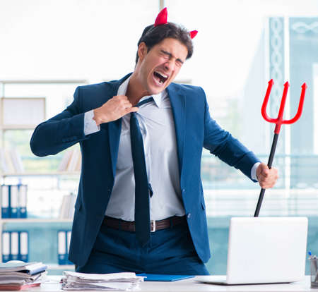 Devil angry businessman in the office
