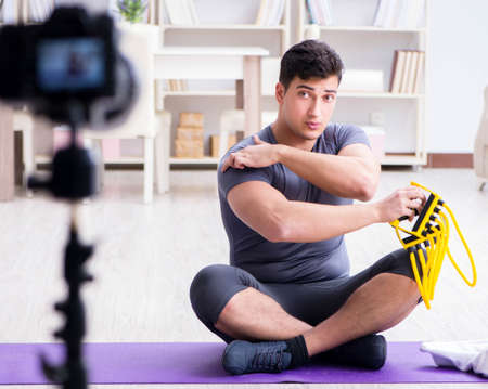 Sports and health blogger recording video in sport conceptの写真素材
