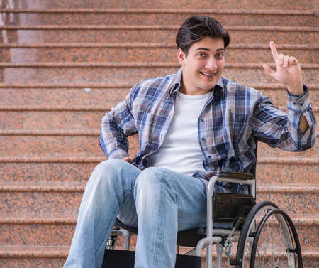 Disabled man on wheelchair having trouble with stairs