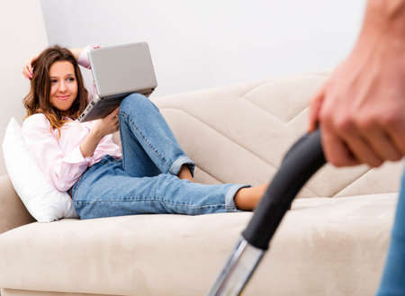 Young family doing cleaning at homeの写真素材