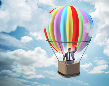 Businessman flying on balloon in challenge conceptの写真素材