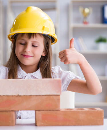Young girl building with construction bricksの写真素材