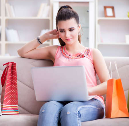 Young woman after shopping with bagsの写真素材