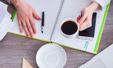The top view of working desk with hands