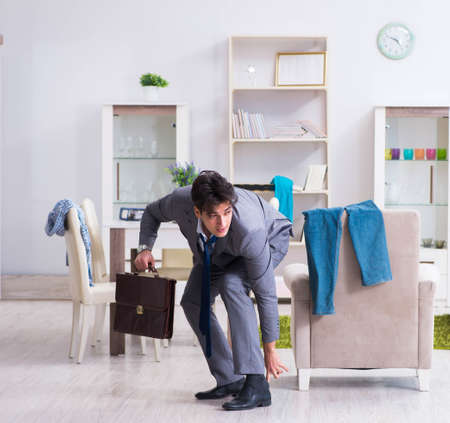 Businessman late for office due to oversleeping after overnightの写真素材