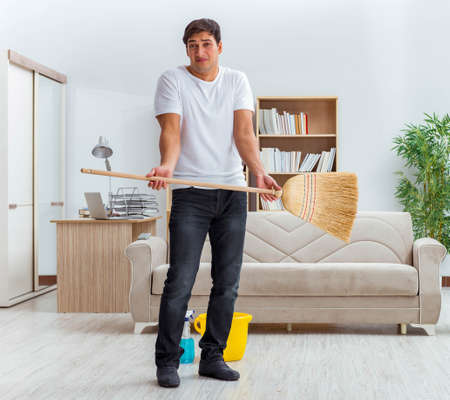 Man husband cleaning the house helping wife