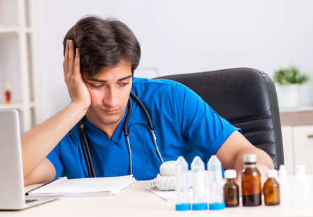 Young doctor working in the hospitalの写真素材