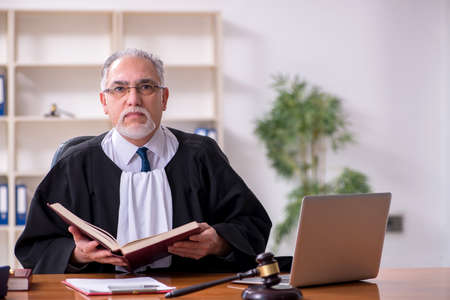 Old male judge working in courthouseの写真素材