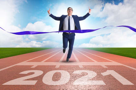 Businessman on finish line to year 2021の写真素材