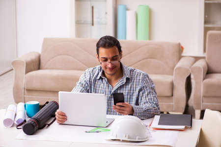 Young male architect working from house during pandemic