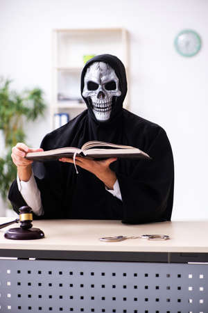 Demon judge working in the courthouseの写真素材