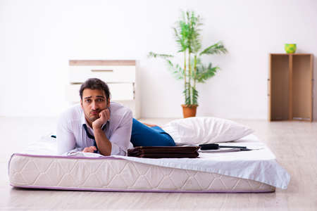 Young male employee working from home during pandemicの写真素材