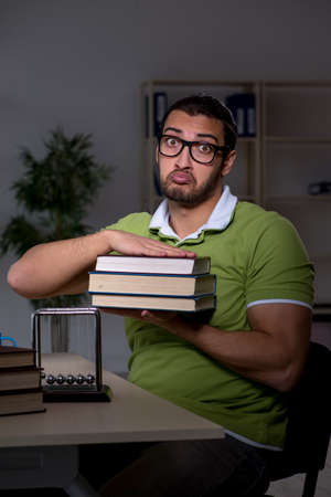 Young male student preparing for exams in the classroomの写真素材