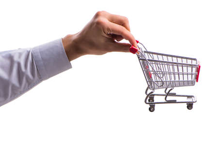 Hand holding shopping cart isolated on whiteの写真素材