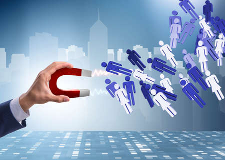 Businessman in recruitment concept with horseshoe magnet