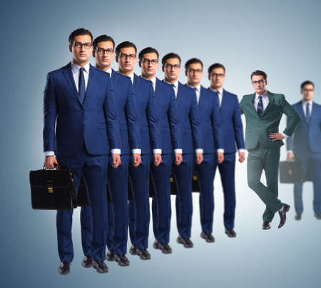 Standing out from the crown concept with businessmanの写真素材