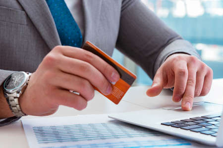 Male businessman doing online shopping with credit cardの写真素材