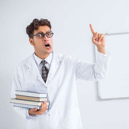 Funny doctor scientist making presentation in hospitalの写真素材