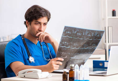 Male doctor radiologist with x-ray can image