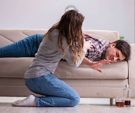 Drinking problem drunk husband man in a young family conceptの写真素材
