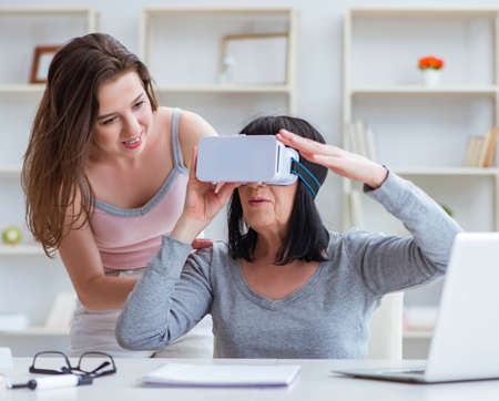 Senior woman experiencing virtual reality glassesの写真素材