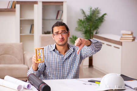 Young male architect working from house during pandemic