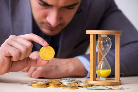 Young man earning money via Internet in time management concept