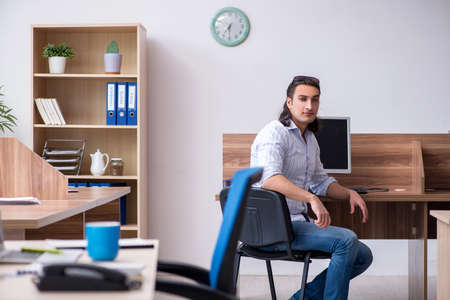 Young male businessman employee working in the officeの写真素材