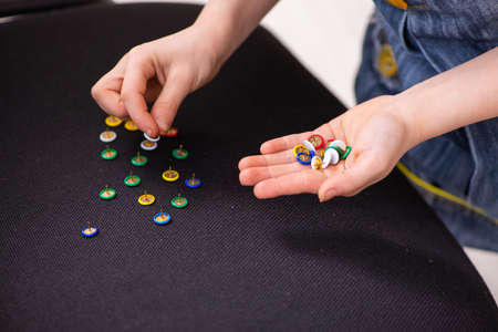 Secondary school prank with sharp thumbtacks on chairの写真素材