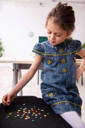 Secondary school prank with sharp thumbtacks on chairの写真素材