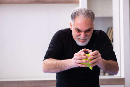 Unhappy old man in retirement conceptの写真素材