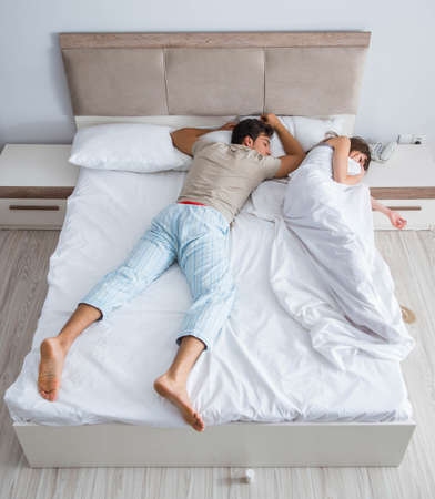 Woman and man in the bedroomの写真素材