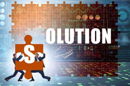 Solution concept with businessman solving jigsaw puzzle