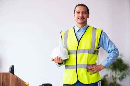 Young male architect working in the office