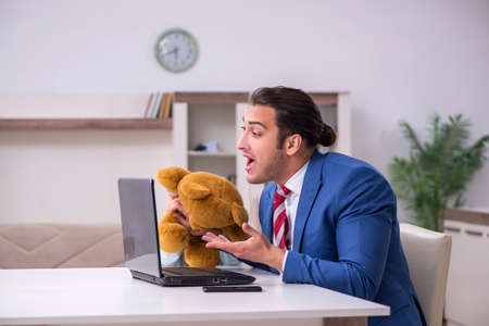 Girl bothering young father during working from house in pandemiの写真素材