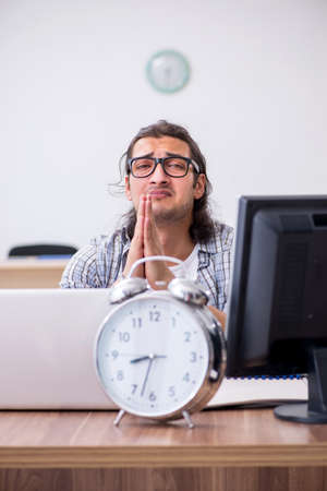 Young male it specialist working in the officeの写真素材