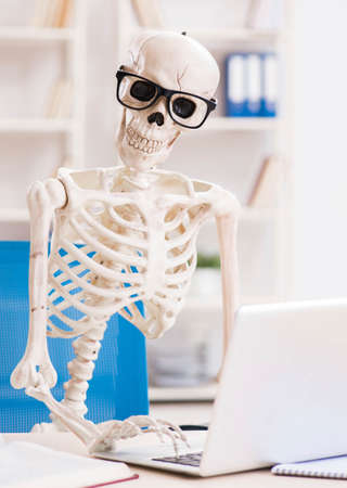 Skeleton businessman working in the officeの写真素材