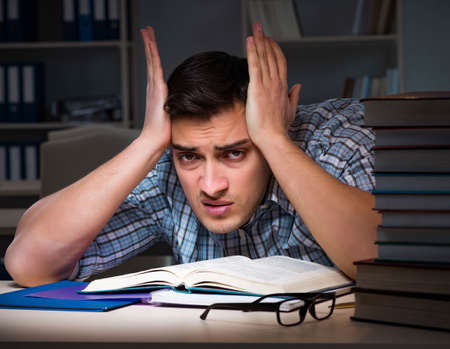Student preparing for exams late at nightの写真素材